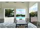 Relaxing poolside patio with table and chairs at 19830 Bridgetown Loop, Venice, FL 34293