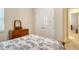 Bright bedroom featuring a double bed, dresser, and spacious closet at 19830 Bridgetown Loop, Venice, FL 34293