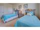 Bedroom featuring two beds, a ceiling fan, and a window for natural light at 20190 Ragazza Cir # 202, Venice, FL 34293