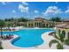 Expansive resort-style pool with surrounding lounge areas at 20190 Ragazza Cir # 202, Venice, FL 34293