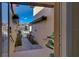 Stylish walkway with brick, desert plants, wrought iron gates and exterior architecture at 20190 Ragazza Cir # 202, Venice, FL 34293