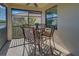 This lanai is a delightful spot with a round table and seating, enhanced by the surrounding natural light at 20190 Ragazza Cir # 202, Venice, FL 34293