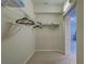 Well-lit walk-in closet featuring wire shelving and carpeting providing plenty of storage space at 20190 Ragazza Cir # 202, Venice, FL 34293