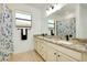 Bathroom with double vanity, granite countertop, and shower/tub combo at 20391 Lagente Cir, Venice, FL 34293