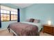 Comfortable bedroom with a king-size bed and nightstand at 20391 Lagente Cir, Venice, FL 34293