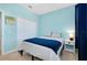 Bright bedroom with a full bed, and blue and white bedding at 20391 Lagente Cir, Venice, FL 34293