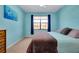 Spacious bedroom with a king-size bed and large window at 20391 Lagente Cir, Venice, FL 34293