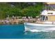 Luxury boat cruising by park with people relaxing on the shore at 20391 Lagente Cir, Venice, FL 34293
