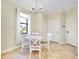 Charming breakfast nook with a white table and four chairs at 20391 Lagente Cir, Venice, FL 34293