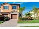 Two-story townhome with a two-car garage and neatly landscaped front yard at 20391 Lagente Cir, Venice, FL 34293