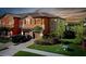 Attractive two-story townhome with a two-car garage and nicely landscaped front yard at 20391 Lagente Cir, Venice, FL 34293