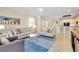 Spacious living area with comfortable seating and blue rug at 20391 Lagente Cir, Venice, FL 34293