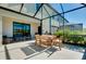 Outdoor patio with seating area and dining table at 20391 Lagente Cir, Venice, FL 34293
