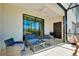 Cozy screened patio with seating area and grill at 20391 Lagente Cir, Venice, FL 34293