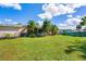 Spacious backyard with screened patio at 2151 Broom Ct, Port Charlotte, FL 33952