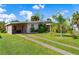 View of the home's front with double driveway at 2151 Broom Ct, Port Charlotte, FL 33952