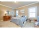 Bright bedroom with a comfortable queen bed and ample natural light at 275 Cassano Dr, Nokomis, FL 34275