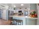 Modern kitchen with light blue cabinets, white countertops, and stainless steel appliances at 3358 Yukon Dr, Port Charlotte, FL 33948