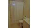 Clean bathroom featuring a shower with curtain, toilet, vanity, and neutral colors for a fresh look at 359 Longwood Dr, Venice, FL 34285