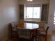 Cozy dining area featuring built-in cabinetry, a window, and an octagonal table with seating at 359 Longwood Dr, Venice, FL 34285