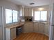 Well-lit kitchen boasts spacious countertops, a convenient workspace, and white appliances at 359 Longwood Dr, Venice, FL 34285