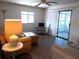 Relaxing living room features comfortable seating, modern flooring, and access to the bright lanai at 359 Longwood Dr, Venice, FL 34285