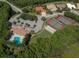 Aerial view of community amenities including tennis courts, pool, and clubhouse at 4245 Via Del Villetti Dr, Venice, FL 34293