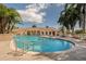 Community pool with expansive patio and lounge chairs at 4245 Via Del Villetti Dr, Venice, FL 34293