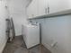 Bright laundry room with washer, dryer and cabinets at 4245 Via Del Villetti Dr, Venice, FL 34293