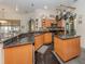 Modern kitchen with island, granite countertops and stainless steel appliances at 4245 Via Del Villetti Dr, Venice, FL 34293