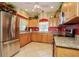 Well-appointed kitchen with granite countertops and stainless steel appliances at 4245 Via Del Villetti Dr, Venice, FL 34293