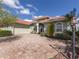 House exterior showcasing a paver driveway and palm trees at 4245 Via Del Villetti Dr, Venice, FL 34293