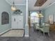 Elegant entryway with double doors and a view of the dining room at 4245 Via Del Villetti Dr, Venice, FL 34293