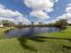 Landscaped backyard with lake view at 4245 Via Del Villetti Dr, Venice, FL 34293