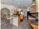 Modern kitchen with granite countertops and breakfast bar at 4245 Via Del Villetti Dr, Venice, FL 34293