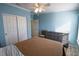 Bedroom with double bed, dresser, and ceiling fan at 428 Boxwood Dr, Venice, FL 34285