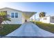 Single-Gathering home with covered carport and landscaping at 428 Boxwood Dr, Venice, FL 34285