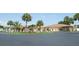 Community clubhouse and landscaping with palm trees at 428 Boxwood Dr, Venice, FL 34285