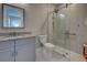 Updated bathroom features granite countertops and a frameless glass shower at 569 Mistiflower Cir, Nokomis, FL 34275