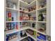 Well-organized pantry with ample shelving for food storage at 569 Mistiflower Cir, Nokomis, FL 34275