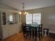 Bright dining area with a built-in hutch and light-colored wood floors at 6234 Parakeet Rd, Englewood, FL 34224