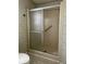 Bathroom includes sliding glass shower doors at 6234 Parakeet Rd, Englewood, FL 34224