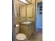 Compact bathroom features vanity, mirror, and toilet with classic finishes and a bright ambiance at 6234 Parakeet Rd, Englewood, FL 34224
