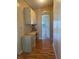 Hallway with built in desk and cabinets and view of a bedroom at 6234 Parakeet Rd, Englewood, FL 34224