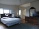 Relaxing main bedroom with ceiling fan, three windows, and ensuite bathroom entrance at 6234 Parakeet Rd, Englewood, FL 34224