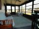 Relaxing sunroom featuring seating and a view of the outdoors, perfect for enjoying the Florida sunshine indoors at 6234 Parakeet Rd, Englewood, FL 34224