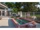 Community hot tub with brick border and pool rules sign at 649 Crossfield Cir # 10, Venice, FL 34293