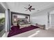 Main bedroom with a luxurious bed and access to a balcony at 8057 Weyers Ct, Englewood, FL 34224