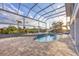 Inviting kidney-shaped pool with a screened enclosure at 8057 Weyers Ct, Englewood, FL 34224