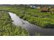 Aerial view of person on boat in canal at 8057 Weyers Ct, Englewood, FL 34224